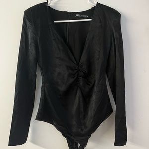 Satin black Zara bodysuit, plunging neckline, padded shoulders, never worn